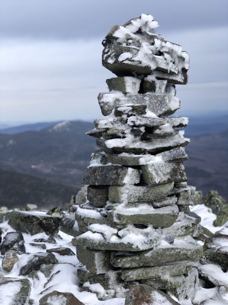 A summit cairn seen while hiking Mt Abraham in the Western Maine Mountains
