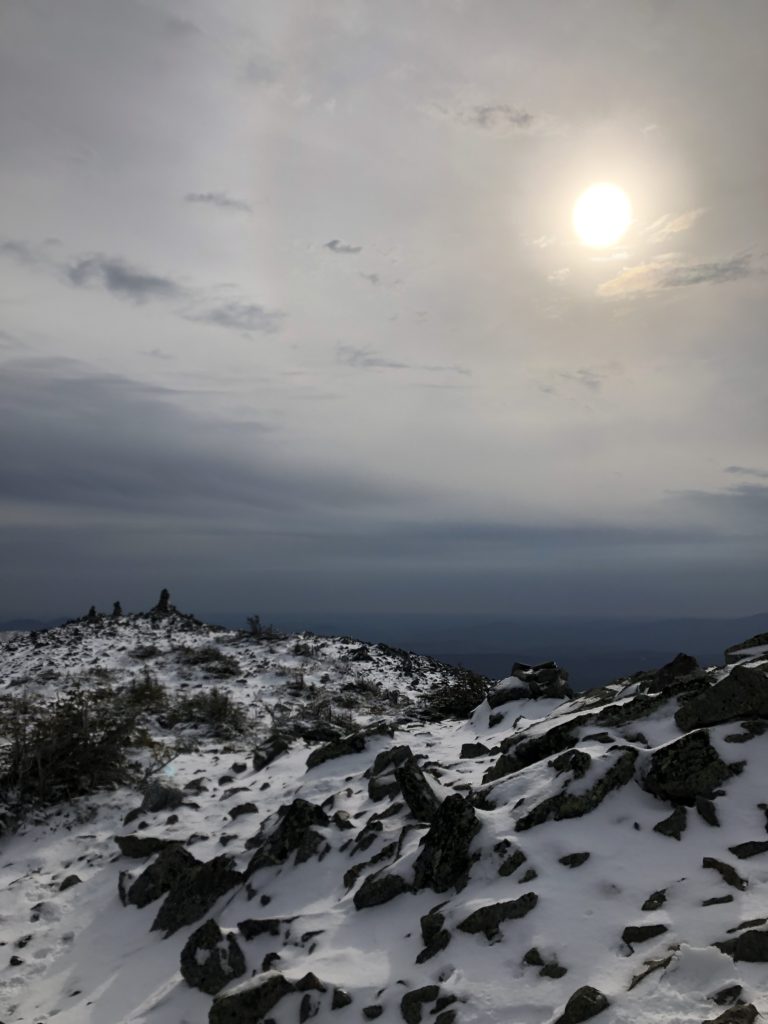 Sun over the summit, seen while hiking Mt Abraham in the Western Maine Mountains