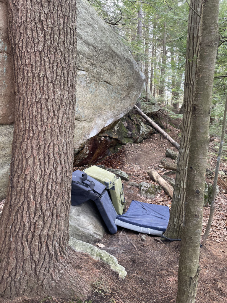 Crash pads in the woods at the South Freeport Boulders
