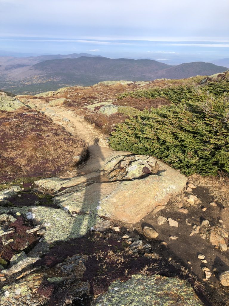 A person's shadow, seen while hiking Mt Monroe and Mt Washington in the White Mountains, New Hampshire
