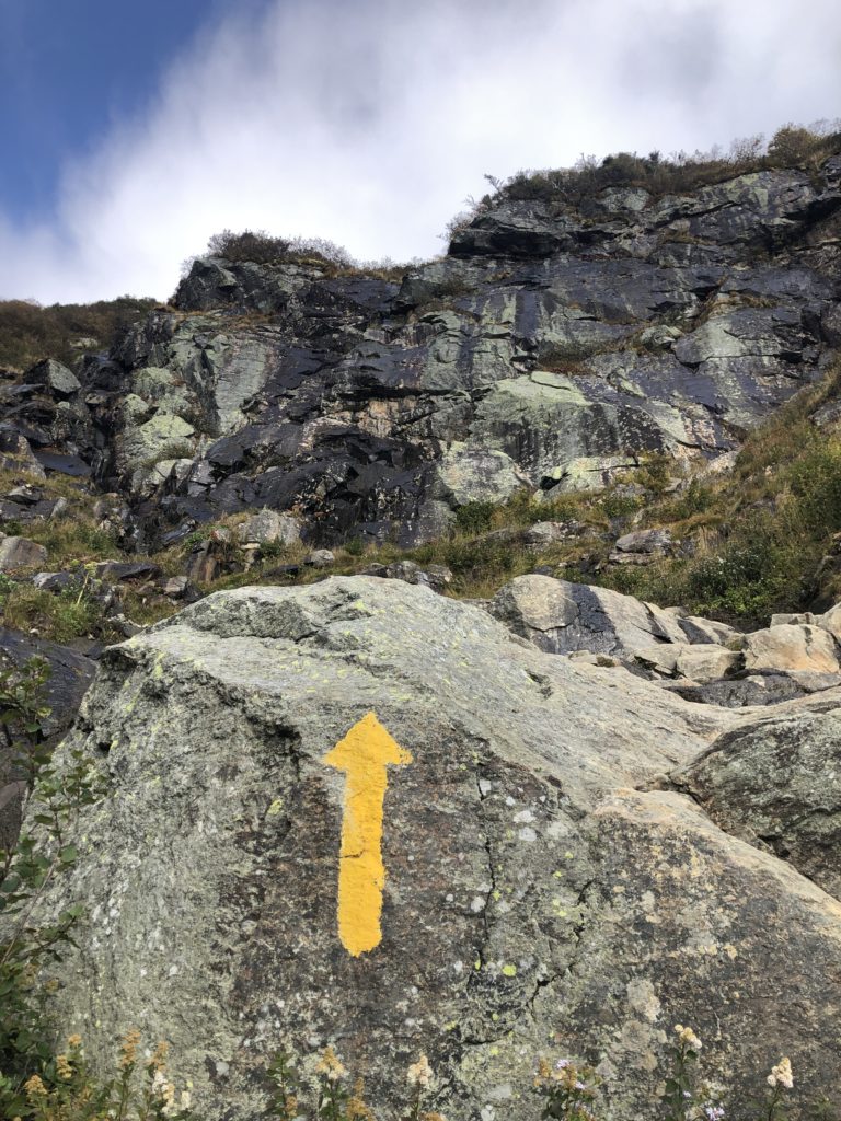 An arrow painted on a boulder seen while hiking Tuckerman Ravine, Mt. Washington, White Mountains, New Hampshire