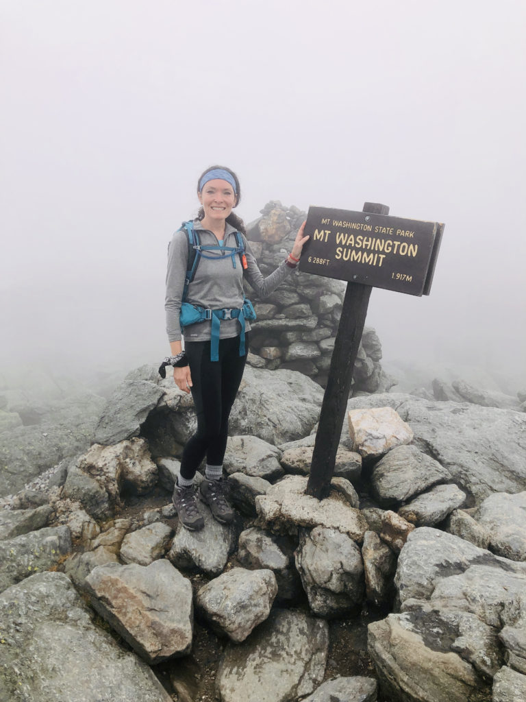 A hiker at the summit after hiking Tuckerman Ravine, Mt. Washington, White Mountains, New Hampshire