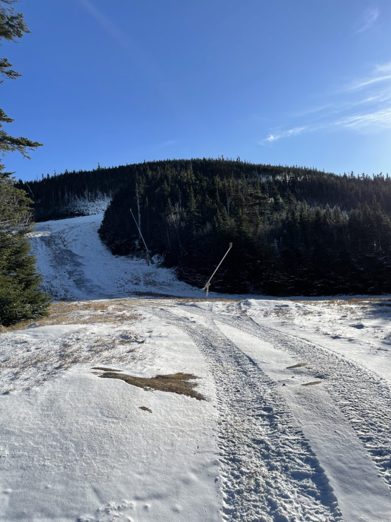 Descending a ski slope while hiking Wildcat Mountain ridge, White Mountains, New Hampshire