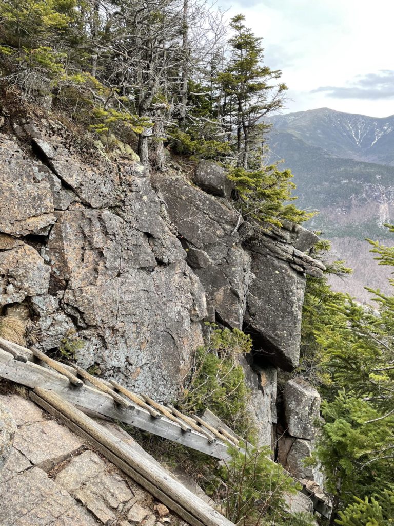 Descending a ladder, seen while hiking Cannon Mountain in the White Mountain National Forest in New Hampshire
