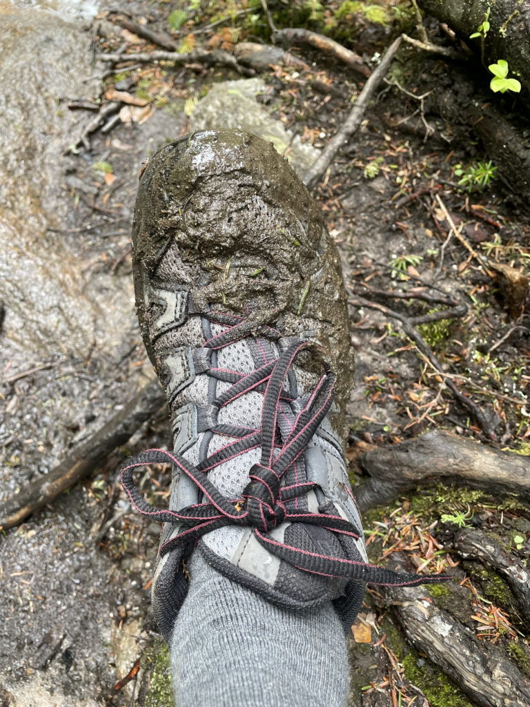A muddy shoe, seen while hiking Mt. Isolation in the White Mountain National Forest, New Hampshire