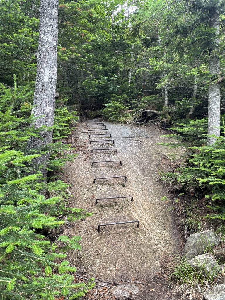 Metal rungs on rock, seen while hiking Saddleback and The Horn, Western Mountains, Maine