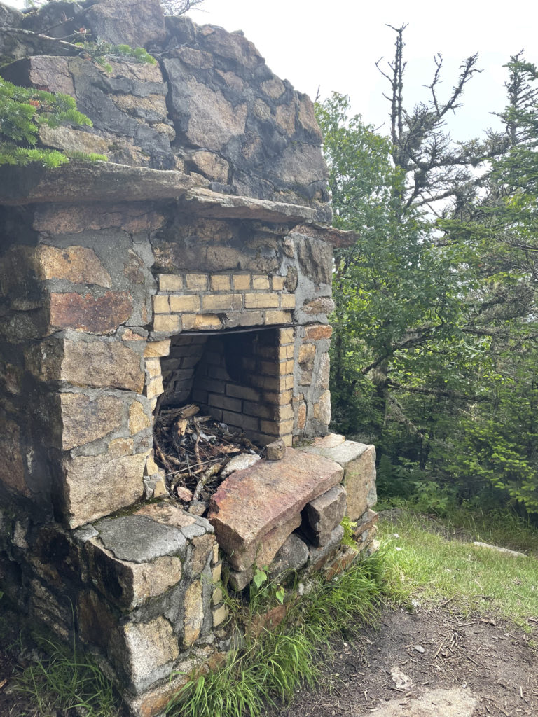 Old fireplace seen while hiking Mt. Waumbek and Mt. Cabot in the White Mountain National Forest, New Hampshire
