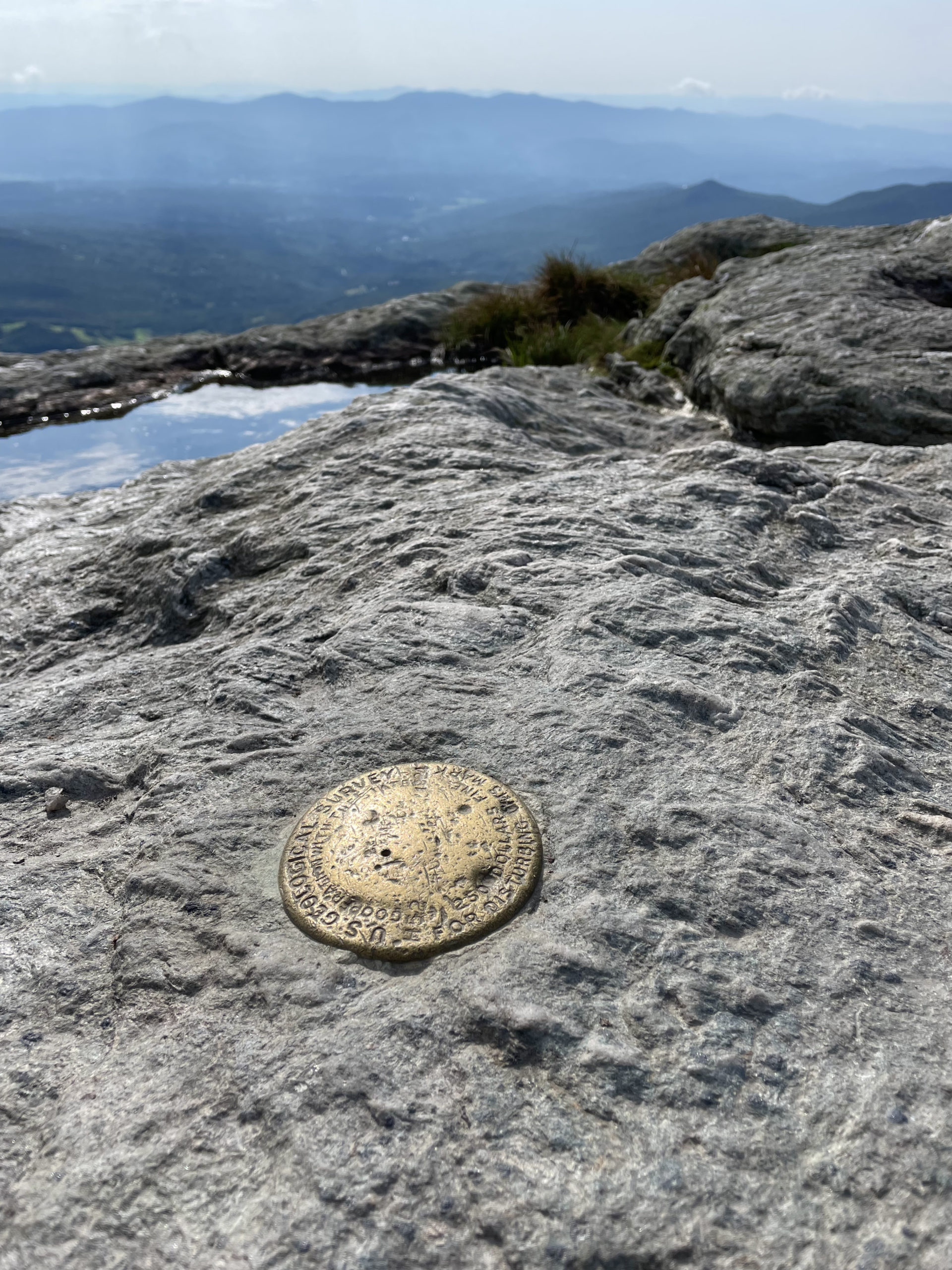 Summit geological marker, seen while hiking Mt. Mansfield in the Green Mountains, Vermont