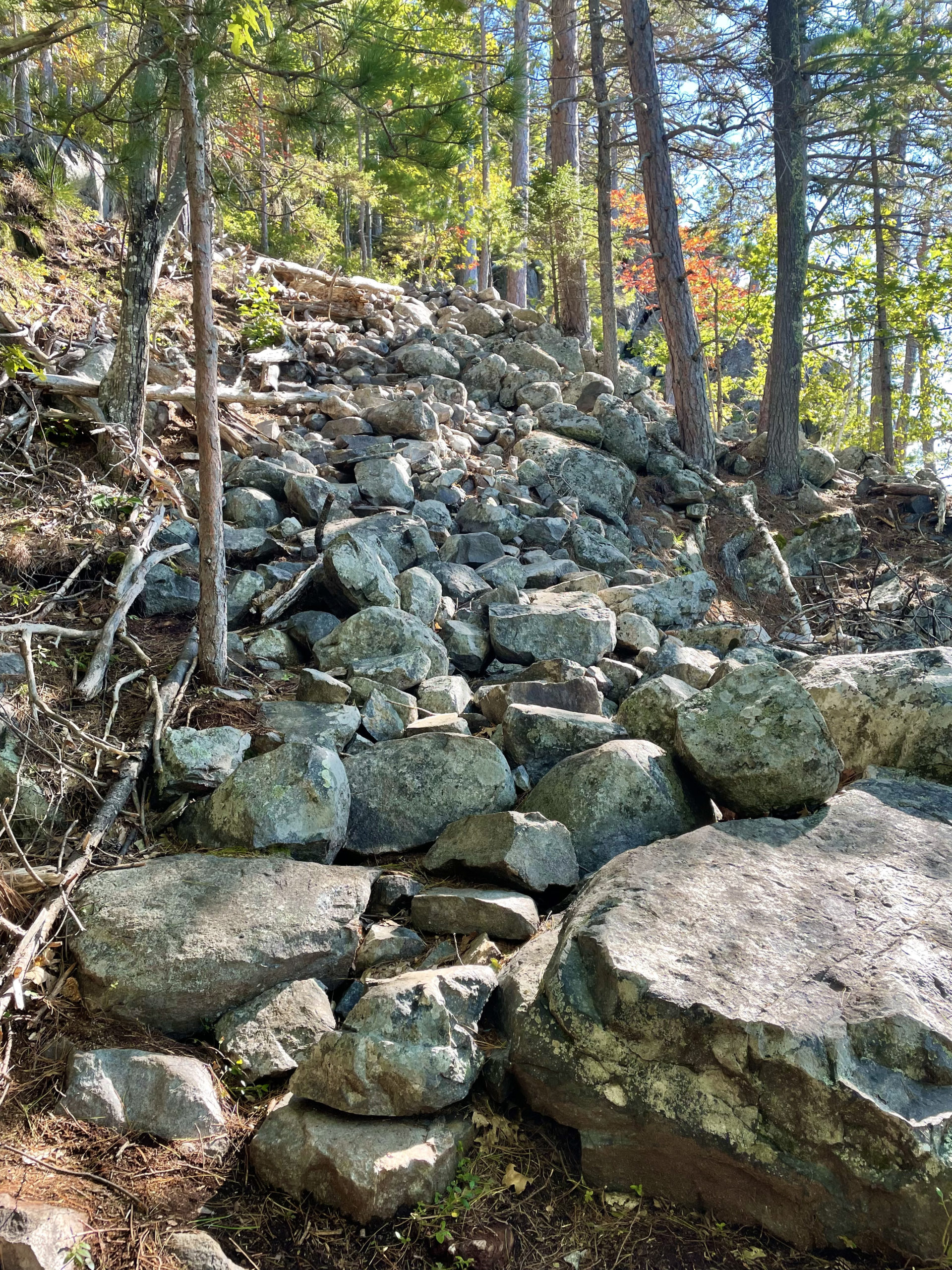 Climbing rocks while hiking South, Middle, and North Moat Mountains in the White Mountain National Forest, New Hampshire