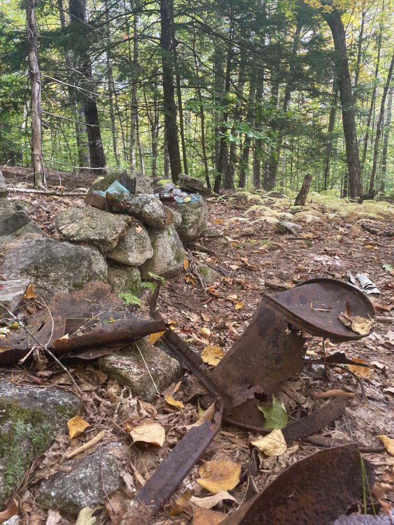 Rusted metal and glass, seen on Mount Tom Trail, Mt. Tom, Fryeburg, Maine