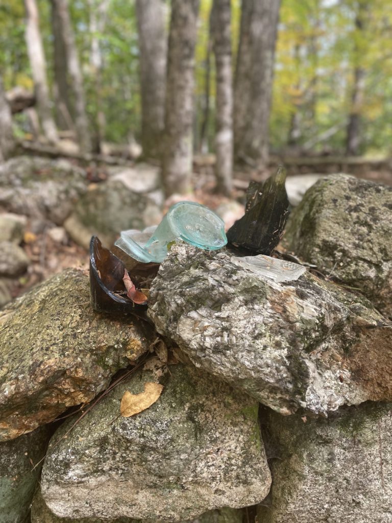 Glass bottle pieces, seen on Mount Tom Trail, Mt. Tom, Fryeburg, Maine