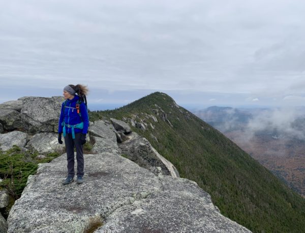 Hiker Sarah Holman on the summit of Doubletop Mountain in Baxter State Park, Maine