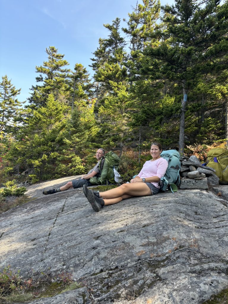 Clients relaxing on Puzzle Mountain, on the Grafton Loop Trail, Grafton Notch, Maine