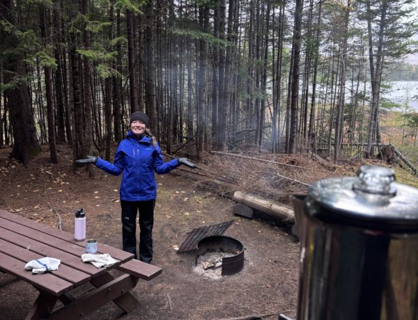 Camper at Kidney Pond in Baxter State Park in October during a snowstorm.